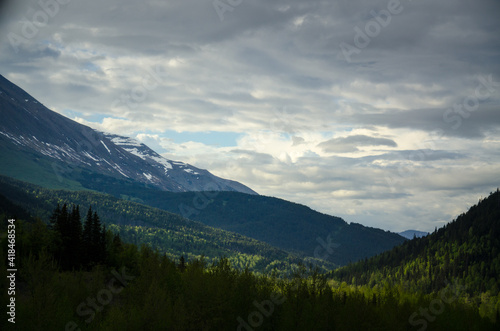 Alaskan mountains with clouds and blue sky