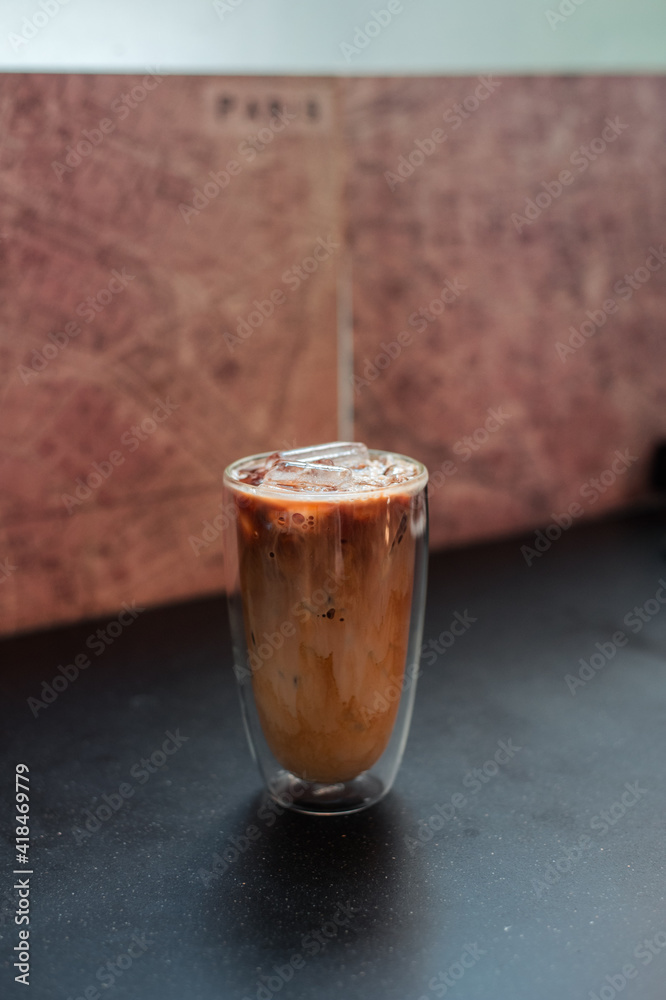 glass of iced coffee with milk on the table