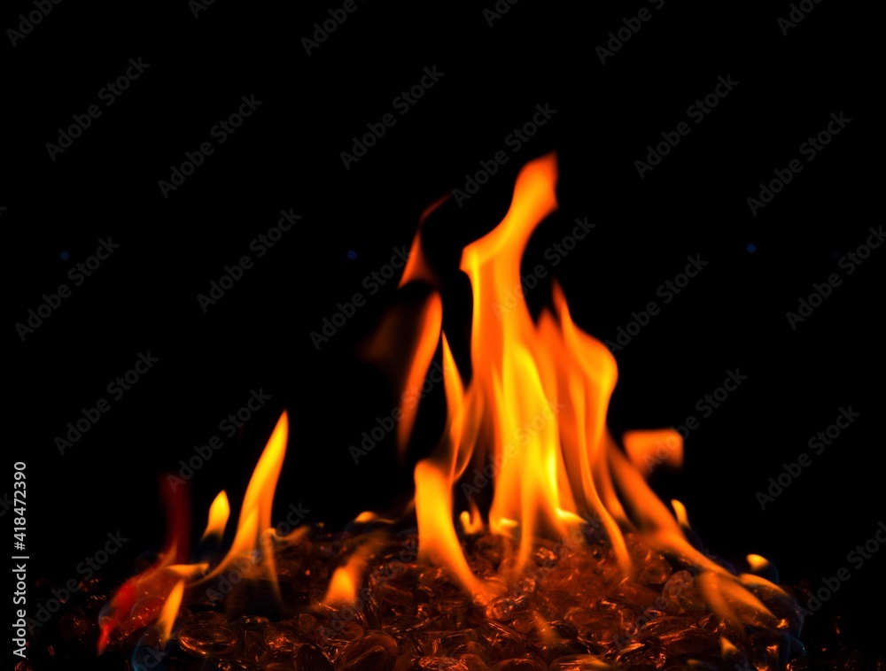 Big orange flame of outdoor fire pit close up and isolated Big orange flame of outdoor fire pit close up and isolated