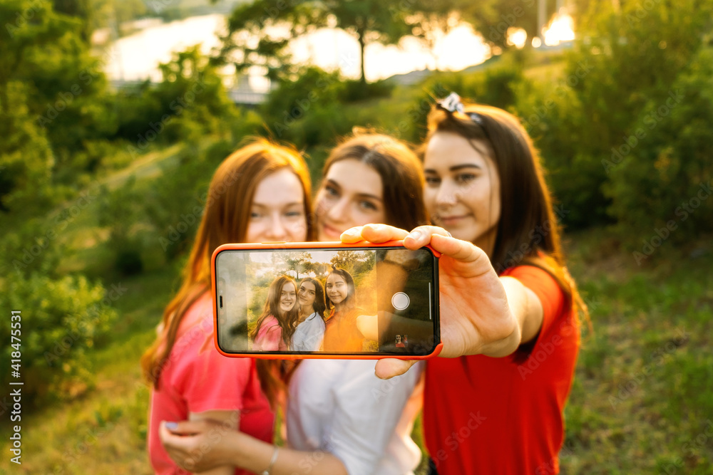 Friends capturing summer memories with a playful selfie – Jacob Lund  Photography Store- premium stock photo