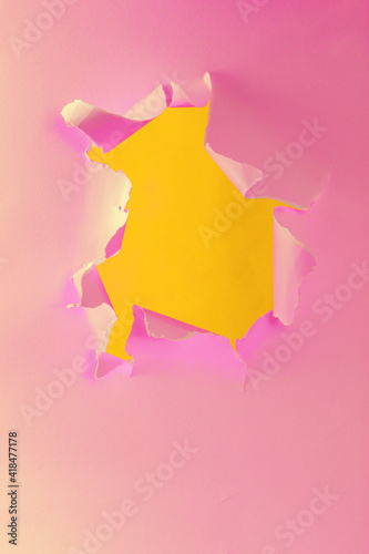 Wallpaper Mural Ripped torn yellow pink paper with hole in center with no people. Copy space for your promotional content, inscription or advertisement. Blank hole to insert object. Torn colored paper. Abstract shot. Torontodigital.ca