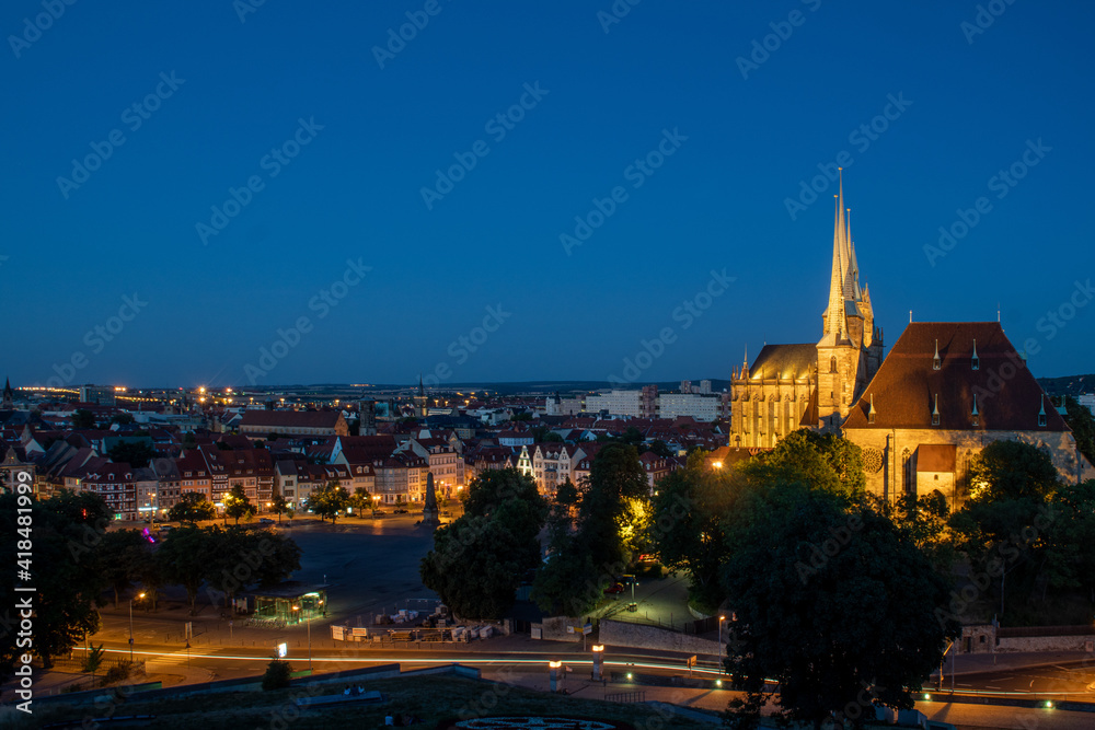 Naklejka premium view of the night sky over the erfurt cathedral in thuringia