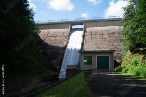 water flows powerfully from a dam in Thuringia