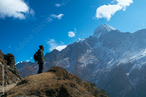 Backpacking hiker on his way to achieve his goals. Success, freedom and happiness, achievements in the mountains. Active sport concept, achieve your challenges. photo taken in the khumbu region, nepal