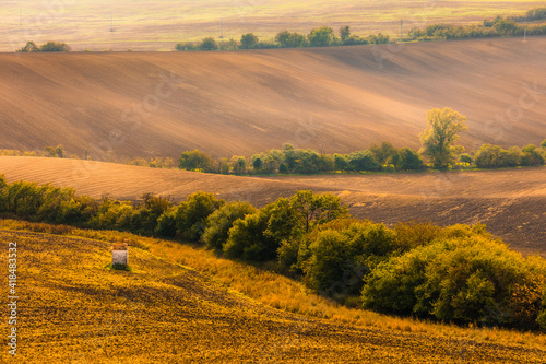 Fototapeta Naklejka Na Ścianę i Meble -  Autumn landscapes in South Moravia, Bohemia. The undulating fields shimmer with shades of green, brown and yellow.
