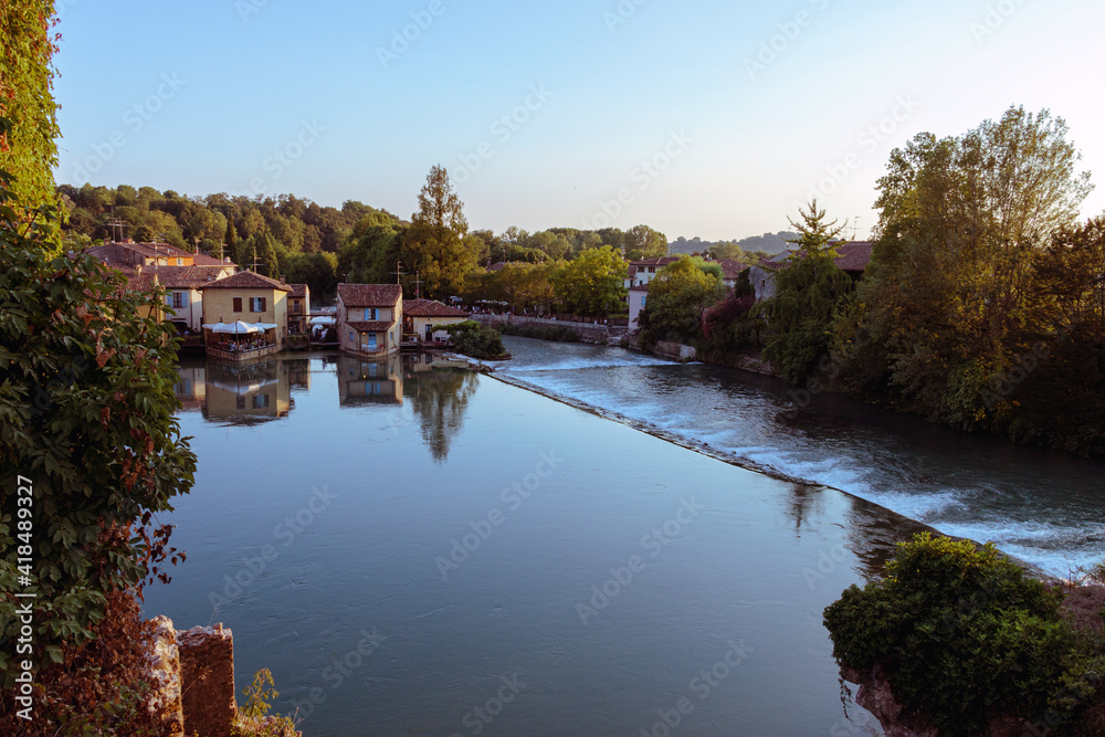 Borghetto, a small village on the Mincio river with an aerial view Borghetto, a small village on the Mincio river with an aerial view