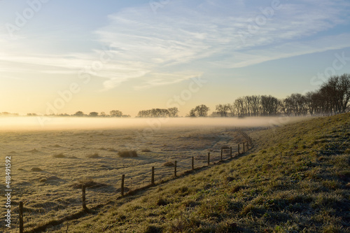 A scenic view of a ground frost over the meadow close to Oss, Netherlands
