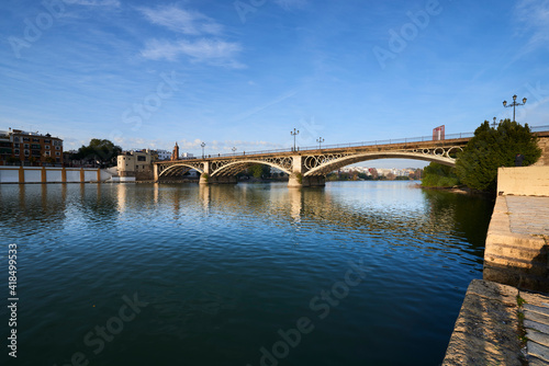 Seville, Andalusia, Spain, Europe. Isabel II bridge or Triana bridge Guadalquivir river