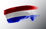 Netherlands flag illustrated on paint brush stroke