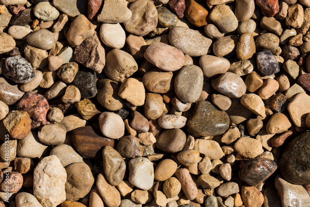 Naklejka premium Wet Stone Pebbles Texture Or Stone Pebbles Background For Design