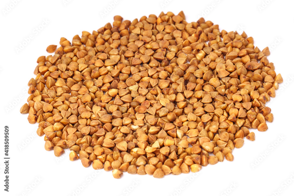 Side view of heap of buckwheat groats isolated on white background. Side view of heap of buckwheat groats isolated on white background.