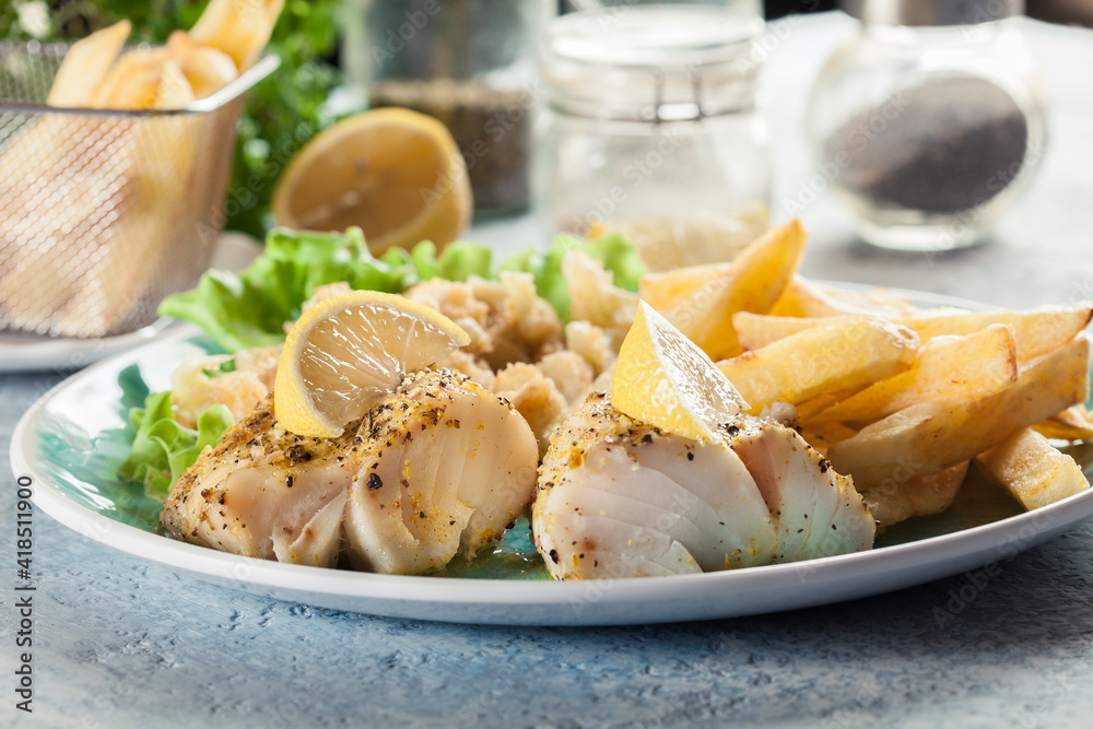 Steamed cod fish with french fries and boiled cauliflower Steamed cod fish with french fries and boiled cauliflower