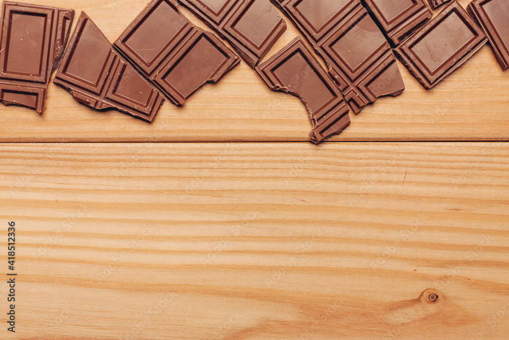 broken brown chocolate bar and background image texture top view broken brown chocolate bar and background image texture top view