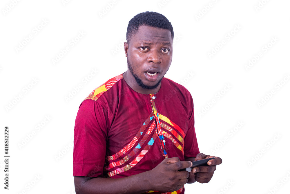 surprised adult man playing game on his cellphone. surprised adult man playing game on his cellphone.