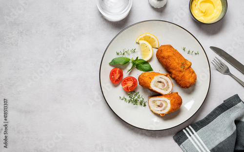 Bilde på lerret French traditional cuisine crispy, creamy chicken cordon bleu on gray background
