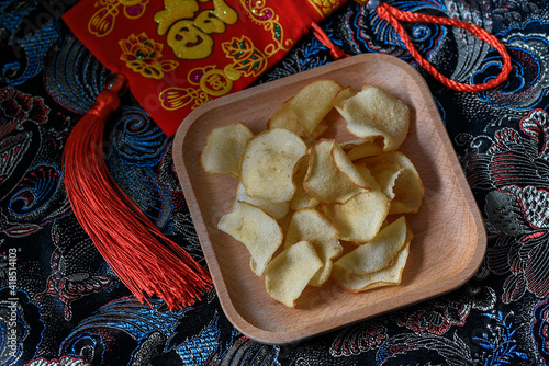 Arrowhead chips or ngaku chips is traditional snacks during Chinese New Year celebration photo