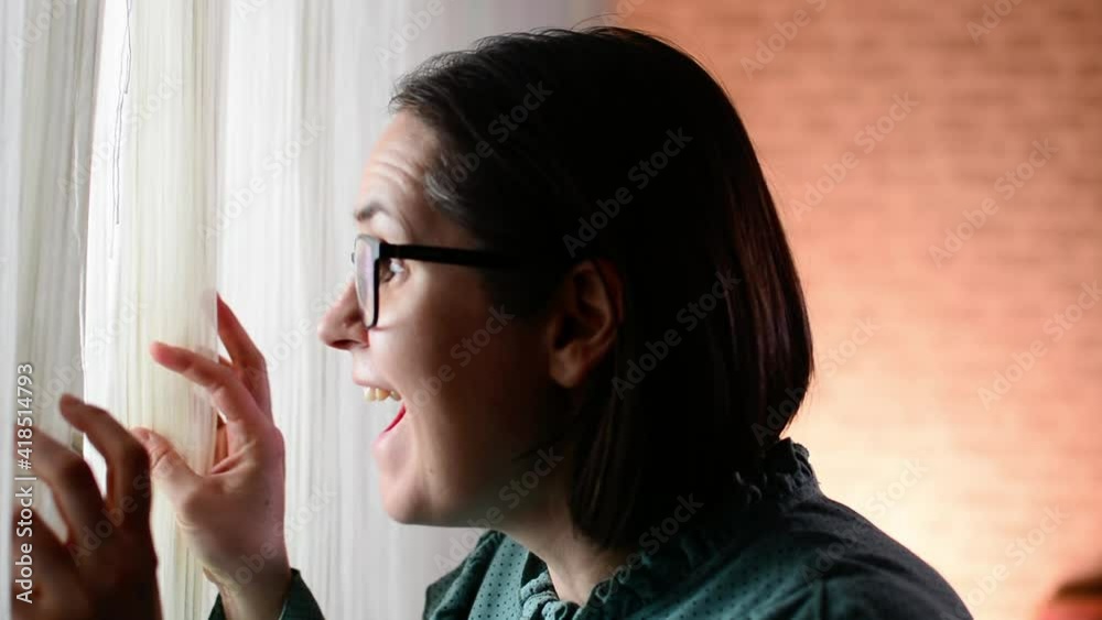 close up of woman opening window curtains close up of woman opening window curtains