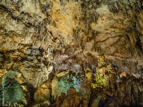 colorful iluminated interior of the stalactite caves, called cuevas de nerja, nerja caves near the city of Nerja, spain