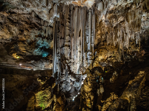 colorful iluminated interior of the stalactite caves, called cuevas de nerja, nerja caves near the city of Nerja, spain