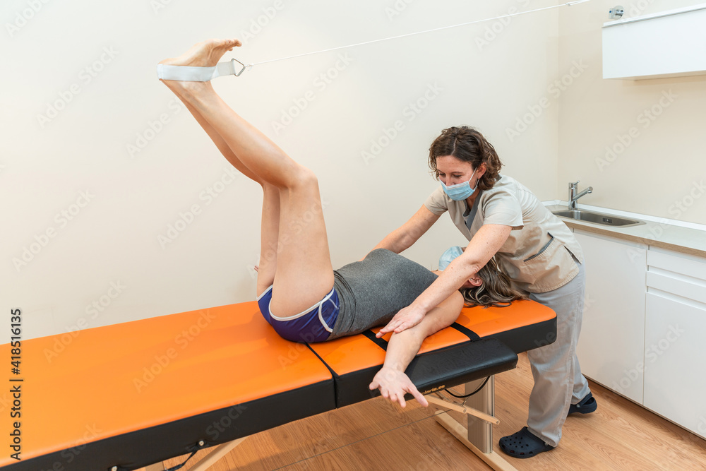 physiotherapist with patient, Coxofemoral angle closure posture to stretch