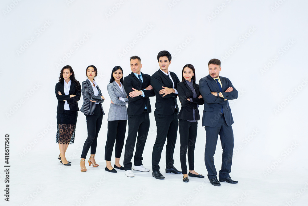 Obraz premium Full picture of a professional team standing with arms folded and looking at the camera..