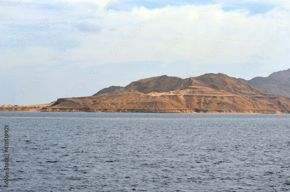 View of Tiran island. Saudi Arabia. From Red Sea, Sharm el Sheikh, Sinai, Egypt. View of Tiran island. Saudi Arabia. From Red Sea, Sharm el Sheikh, Sinai, Egypt.
