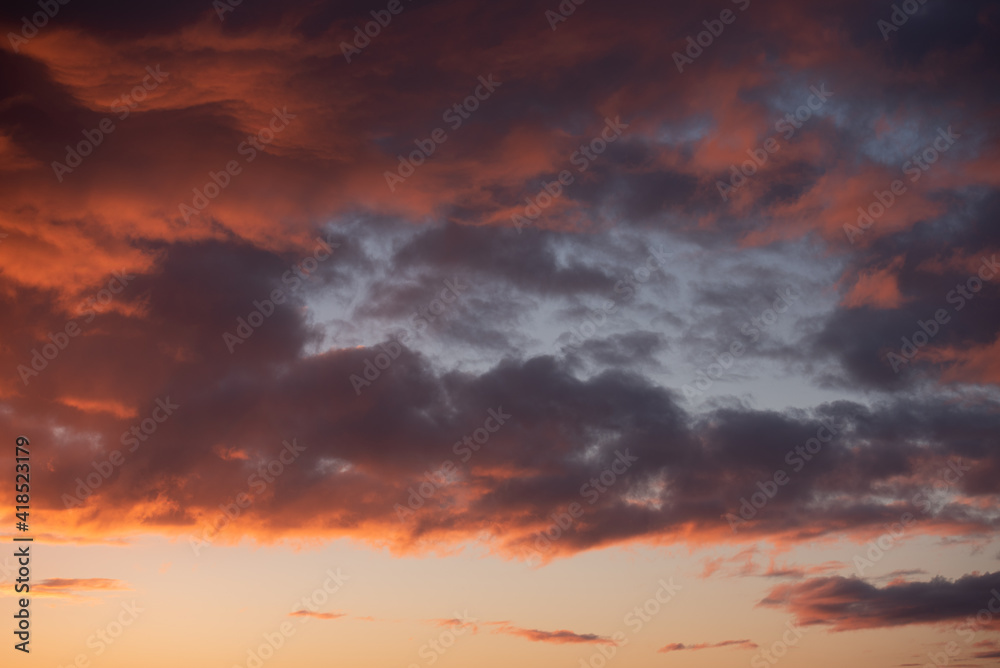 Sky and clouds with red and orange light before sunrise at dawn