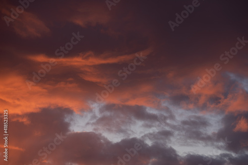 Sky and clouds with red and orange light before sunrise at dawn