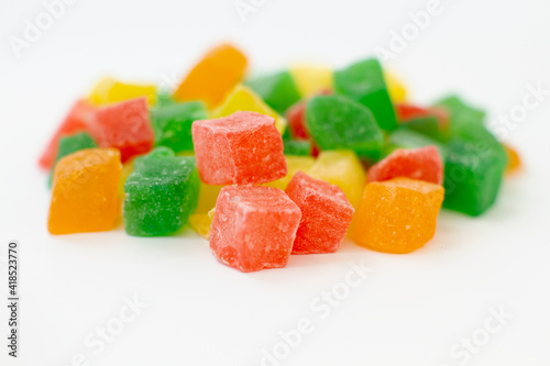 Colorful cubes dry fruit candied peel on white background
