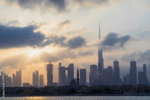 Dubai, UAE - 03.06.2021 Dubai public beach with city skyline on background.Sunrise hour. Outdoor