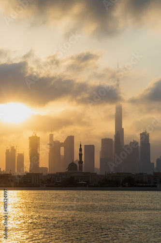 Dubai  UAE - 03.06.2021 Dubai public beach with city skyline on background.Sunrise hour. Outdoor