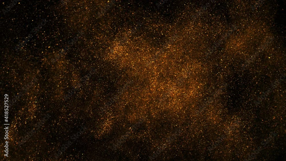 Super Slow Motion Shot of Golden Glitter Background Isolated on Black at 1000 fps.