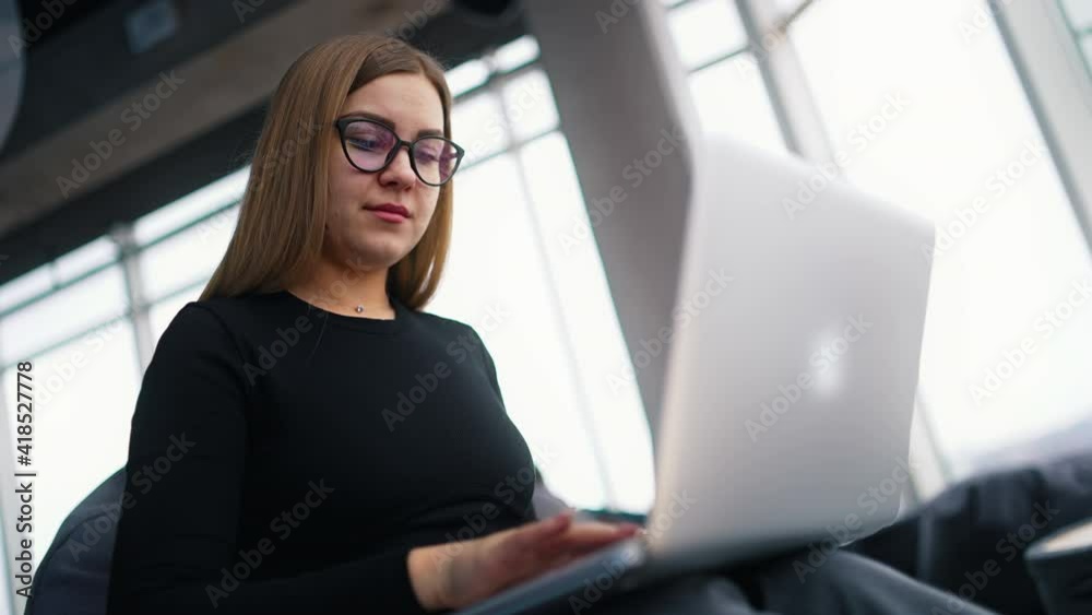 cheerful businesswoman at home office working on computer cheerful businesswoman at home office working on computer