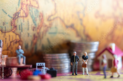 Miniature : group of businessmen standing back with coins and a vintage background.