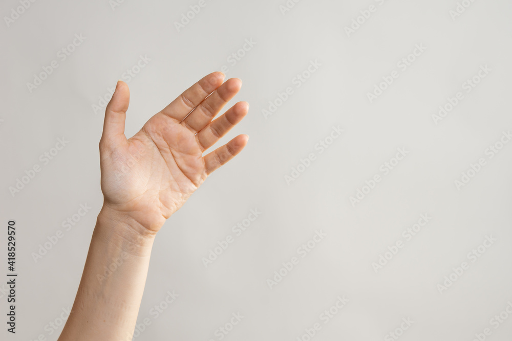 Naklejka premium Hand gestures, to wave Hello. Greeting someone. light grey background
