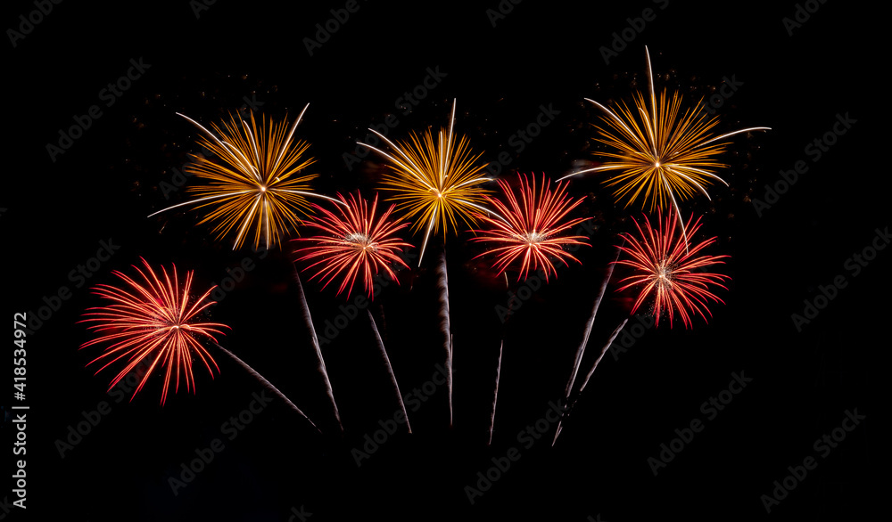 Fireworks with different color and pattern for celebration in various event including new year, party, ceremony, birthday or other show and display on night dark sky background.