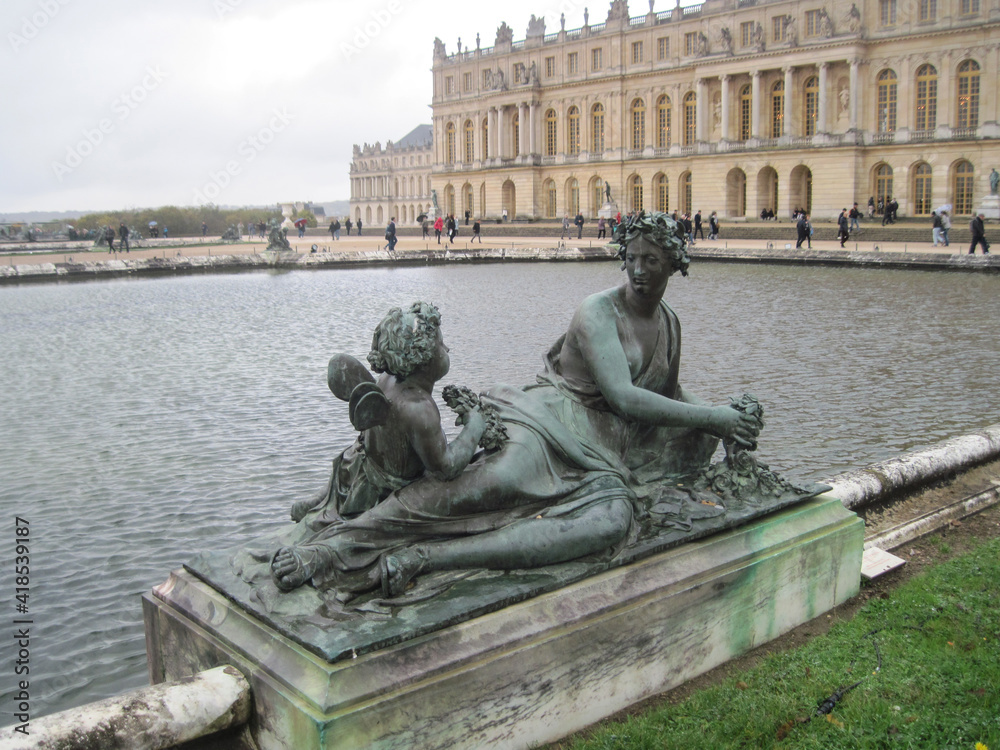 Beautiful sculpture in the Versailles Garden on a rainy day. Travel to European Union. UNESCO World Heritage Site. Beautiful sculpture in the Versailles Garden on a rainy day. Travel to European Union. UNESCO World Heritage Site.