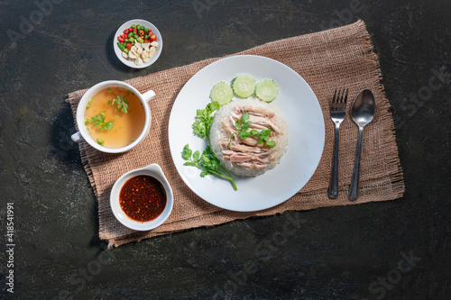 Sliced Hainan-style chicken with marinated rice and soup (Khao Mun Kai)or steamed chicken rice - Asian food style