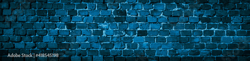 blue brick wall with a visible texture. background