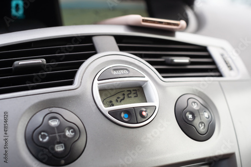 Dashboard in a passenger car. Heating and air conditioning control buttons.