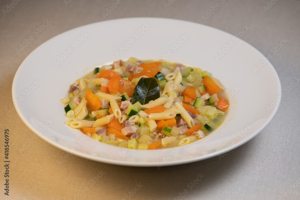 Fresh Vegetable soup and pasta in a white bowl , France Fresh Vegetable soup and pasta in a white bowl , France
