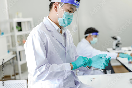 .Scientists are wearing medical gloves. In order to Continue experimenting.