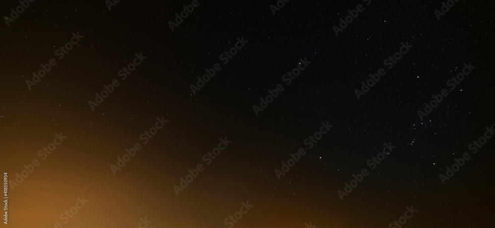 Obraz premium Beautiful winter dark starry sky. Night photography, astronomical background.