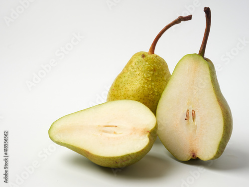 Green pear with a leaf isolated on white. Pear Clipping Path. Professional studio photo