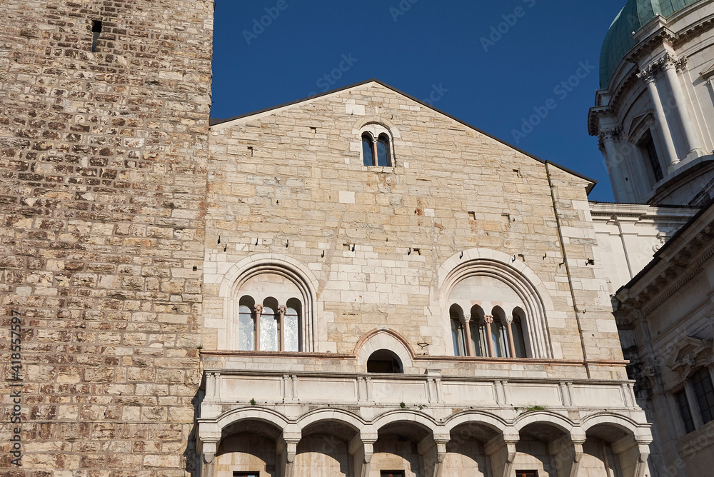 Brescia, Italy - August 22, 2020 : View of Palazzo Broletto and Pegol tower