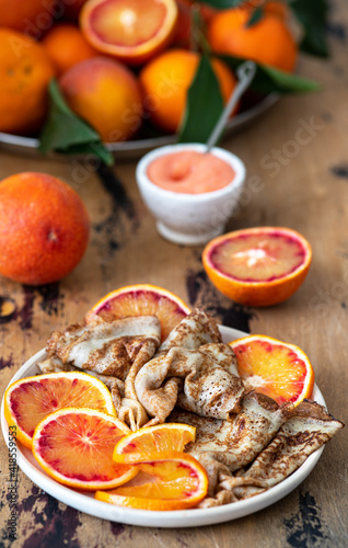 Traditional french crepes with red bloody oranges