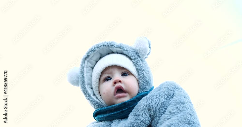 Happy mother playing with little son . Young caucasian mom and baby boy having fun outdoor in winter. slow motion Happy mother playing with little son . Young caucasian mom and baby boy having fun outdoor in winter. slow motion