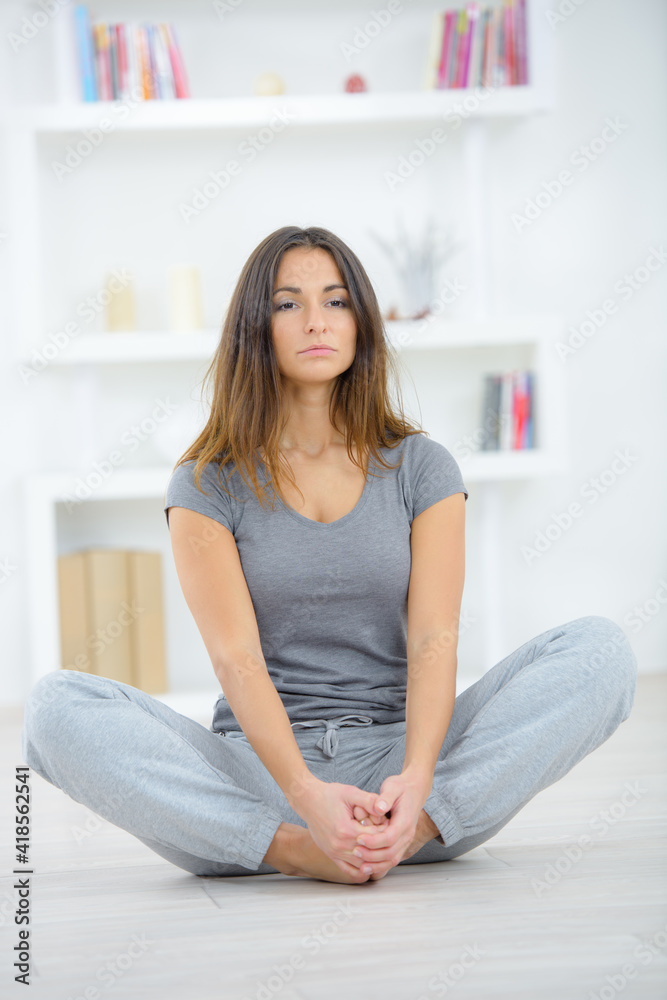 a woman is practising yoga