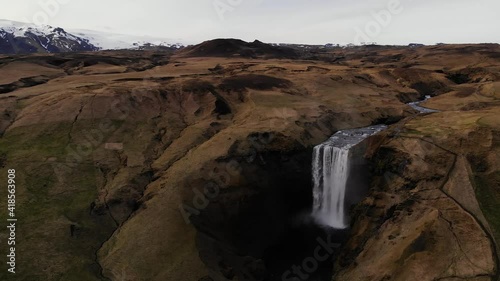 Aerial 4k drone shot of  famous Skógafoss waterfall in Iceland in spring weather in May