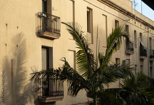 Barcelona, Catalonia, Spain. Romantic narrow residential bystreet in Gothic Quarter. Antique street lamp at wall of old house. Vintage street, European historical street. Old balcony. Barcelona street photo